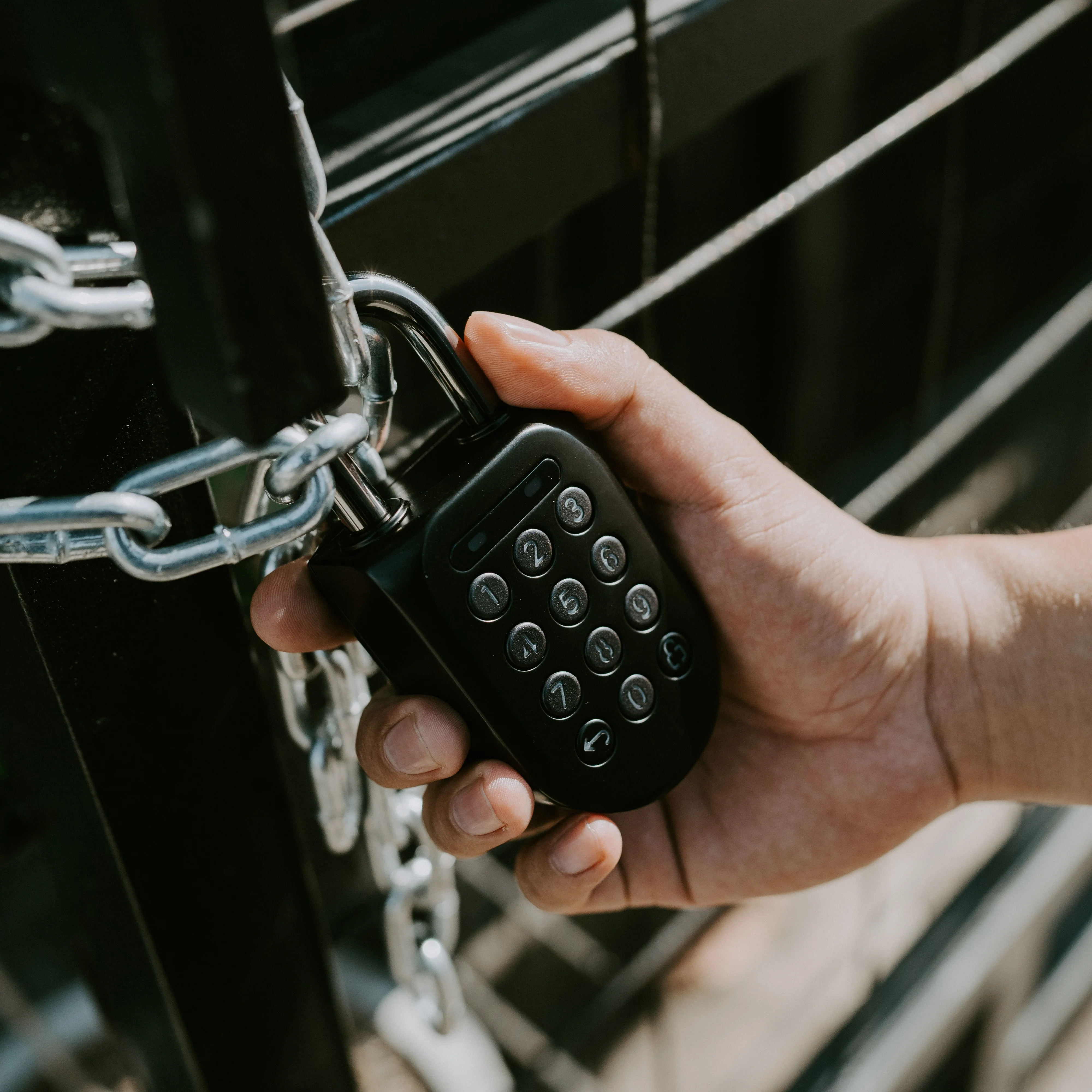 igloohome padlock securing a chain on an outdoor post